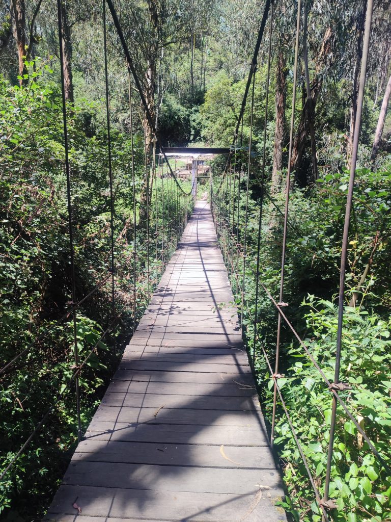 Bridge along the trail to Peguche Waterfall in Otavalo