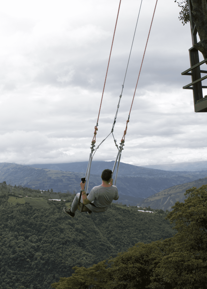 Swing at the end of the world in Banos, Ecuador