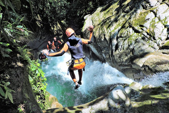 Jumping from waterfalls during a Extreme Canyoning tour in Banos Ecuador