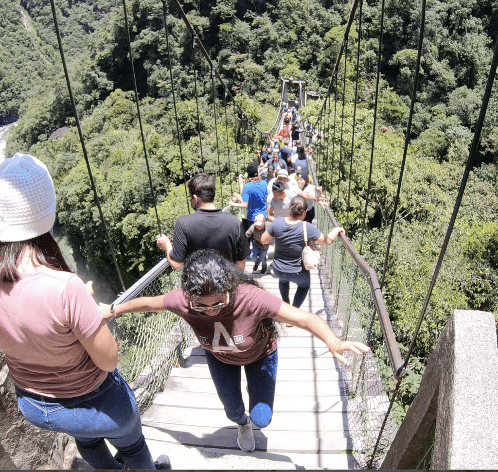 Crowds on the way to Pailon del Diablo Waterfall in Banos Ecuador