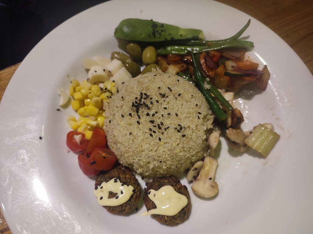 Trying Quinoa powder dish in Ecuadorian restaurante