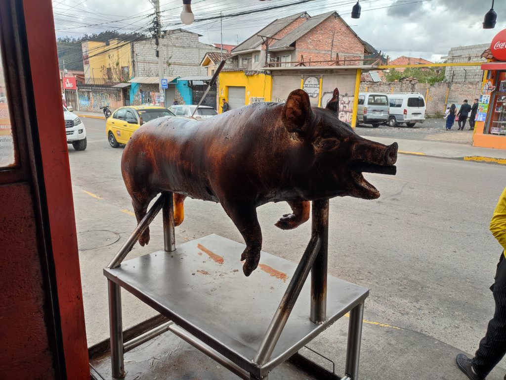 Ecuadorins preparing Hornado