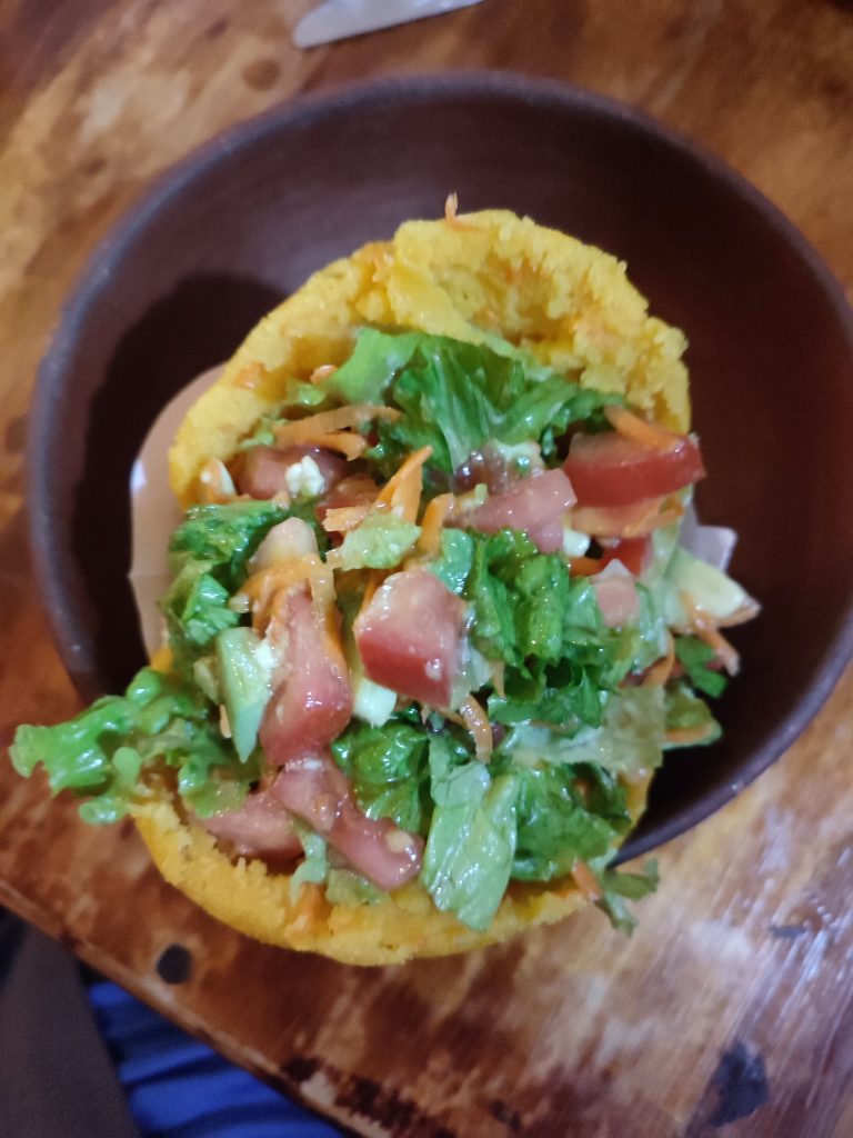 Trying vegan Arepa in Ecuador